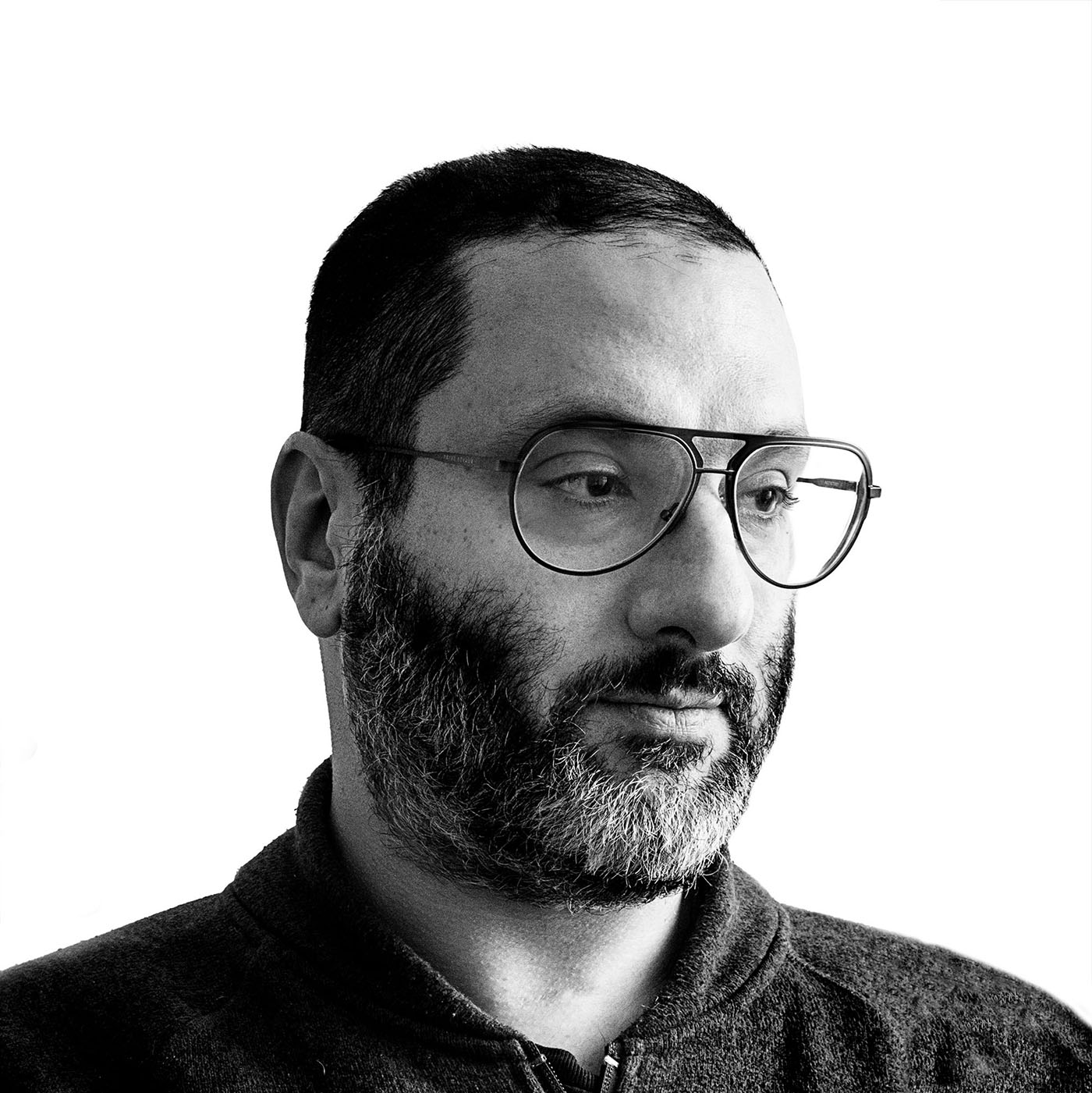 Black-and-white portrait of Jay Muhlin wearing glasses.