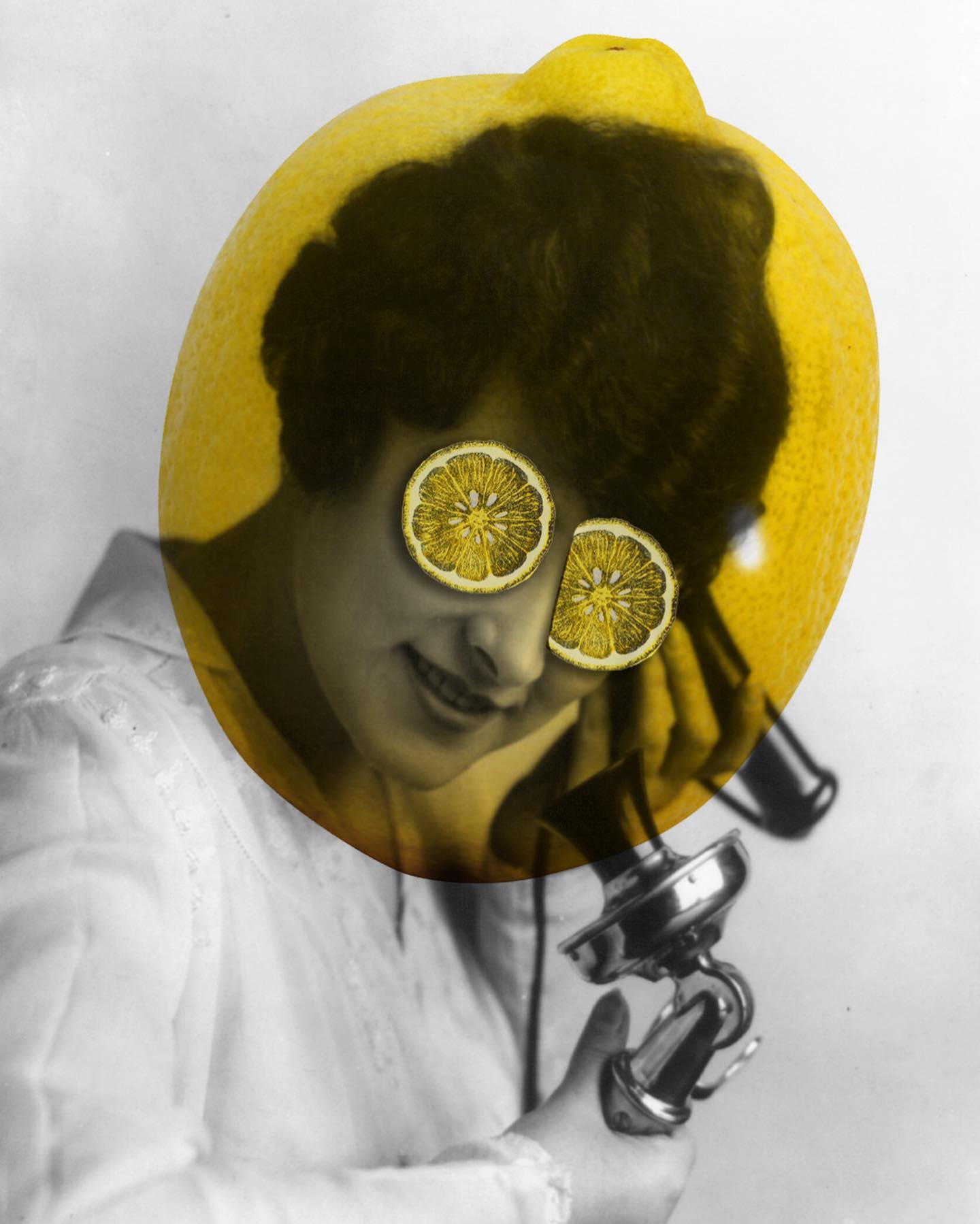 A person using a telephone while wearing lemon-slice glasses in an early Lemon Juice identity-making image.